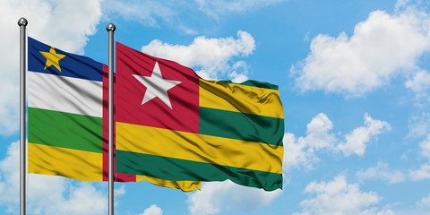 Central African Republic and Togo flag waving in the wind against white cloudy blue sky together. Diplomacy concept, international relations.