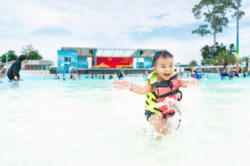 Children playing in the water with fun.