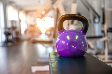  kettlebells on bench in a fitness center, lifestyle, healthy concept