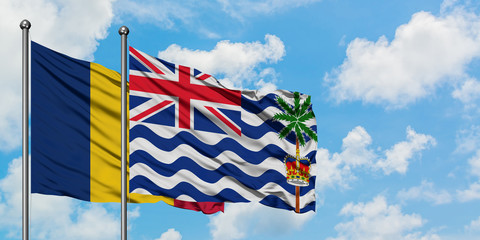 Chad and British Indian Ocean Territory flag waving in the wind against white cloudy blue sky together. Diplomacy concept, international relations.