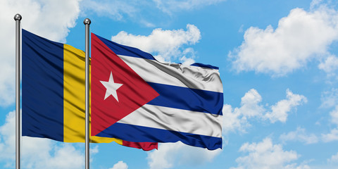 Chad and Cuba flag waving in the wind against white cloudy blue sky together. Diplomacy concept, international relations.