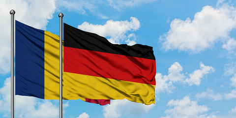 Chad and Germany flag waving in the wind against white cloudy blue sky together. Diplomacy concept, international relations.