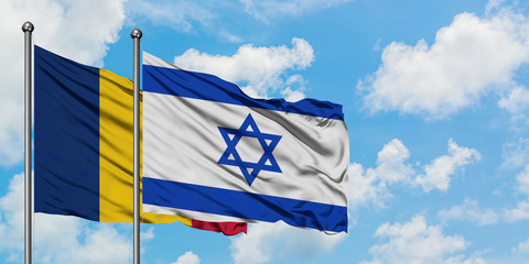 Chad and Israel flag waving in the wind against white cloudy blue sky together. Diplomacy concept,...