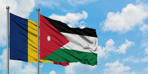 Chad and Jordan flag waving in the wind against white cloudy blue sky together. Diplomacy concept, international relations.