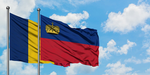Chad and Liechtenstein flag waving in the wind against white cloudy blue sky together. Diplomacy concept, international relations.