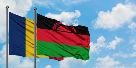 Chad and Malawi flag waving in the wind against white cloudy blue sky together. Diplomacy concept, international relations.