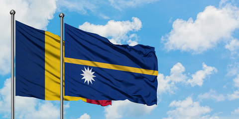Chad and Nauru flag waving in the wind against white cloudy blue sky together. Diplomacy concept,...