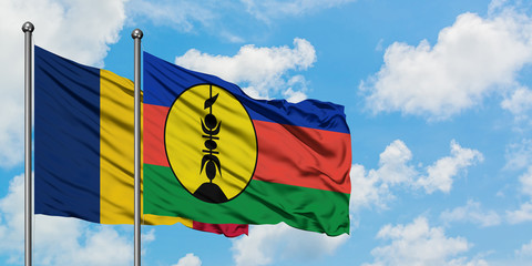 Chad and New Caledonia flag waving in the wind against white cloudy blue sky together. Diplomacy concept, international relations.
