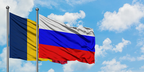 Chad and Russia flag waving in the wind against white cloudy blue sky together. Diplomacy concept, international relations.