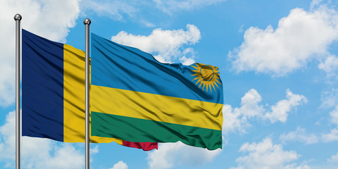 Chad and Rwanda flag waving in the wind against white cloudy blue sky together. Diplomacy concept, international relations.