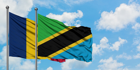 Chad and Tanzania flag waving in the wind against white cloudy blue sky together. Diplomacy concept, international relations.