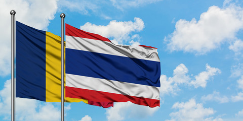 Chad and Thailand flag waving in the wind against white cloudy blue sky together. Diplomacy concept, international relations.
