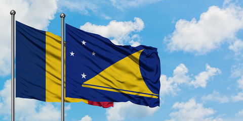 Chad and Tokelau flag waving in the wind against white cloudy blue sky together. Diplomacy concept, international relations.
