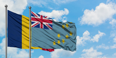 Chad and Tuvalu flag waving in the wind against white cloudy blue sky together. Diplomacy concept,...