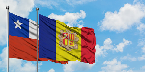 Chile and Andorra flag waving in the wind against white cloudy blue sky together. Diplomacy concept, international relations.
