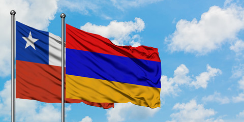 Chile and Armenia flag waving in the wind against white cloudy blue sky together. Diplomacy concept, international relations.