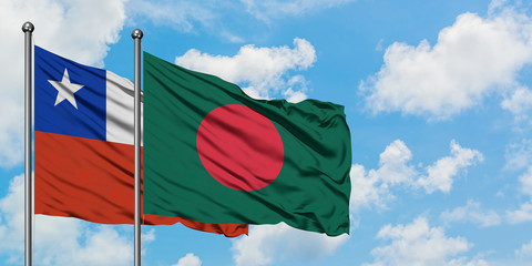 Chile and Bangladesh flag waving in the wind against white cloudy blue sky together. Diplomacy concept, international relations.