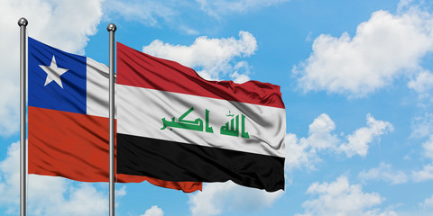 Chile and Iraq flag waving in the wind against white cloudy blue sky together. Diplomacy concept, international relations.