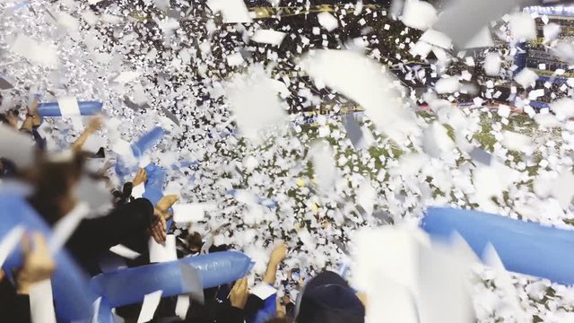 People Trowing Papers At A Soccer Stadium In Argentina.