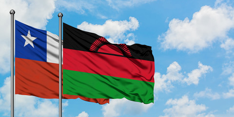 Chile and Malawi flag waving in the wind against white cloudy blue sky together. Diplomacy concept, international relations.