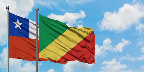 Chile and Republic Of The Congo flag waving in the wind against white cloudy blue sky together. Diplomacy concept, international relations.