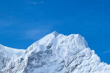 Wonderful Winter Landscape. Splendid Alpine scenery: Snowy Mountains at Grindelwald, Switzerland. Snow-covered mountains. Winter travel concept.