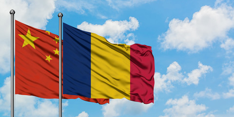 China and Chad flag waving in the wind against white cloudy blue sky together. Diplomacy concept, international relations.
