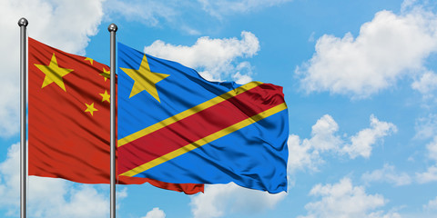 China and Congo flag waving in the wind against white cloudy blue sky together. Diplomacy concept, international relations.