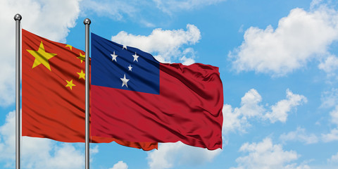 China and Samoa flag waving in the wind against white cloudy blue sky together. Diplomacy concept, international relations.