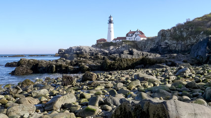 cape elizabeth light and a rocky shoreline at portland, maine