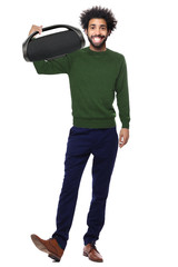 Man with a bluetooth box in front of a white background