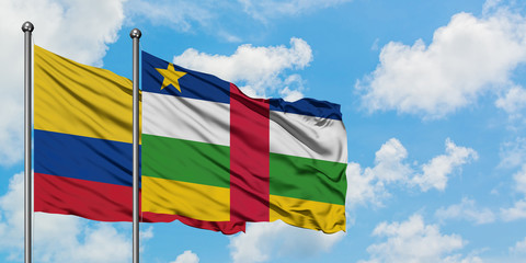 Colombia and Central African Republic flag waving in the wind against white cloudy blue sky together. Diplomacy concept, international relations.