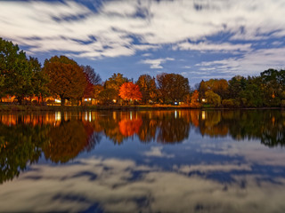 Fototapeta premium reflection of trees on lake in autumn