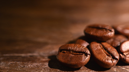 coffee background of roasted coffee beans on wooden background