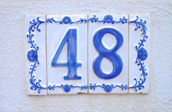 Number 48, forty-eight, decorative tiles on white background.