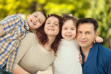 Obraz premium Beautiful smiling Lovely family in park