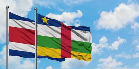 Costa Rica and Central African Republic flag waving in the wind against white cloudy blue sky together. Diplomacy concept, international relations.