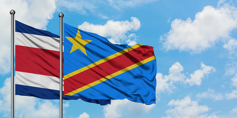 Costa Rica and Congo flag waving in the wind against white cloudy blue sky together. Diplomacy concept, international relations.