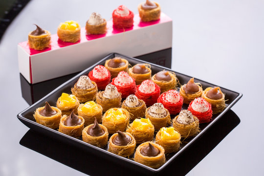 oriental mini bites konafa dessert with fillings,chocolate,chest nuts and mango