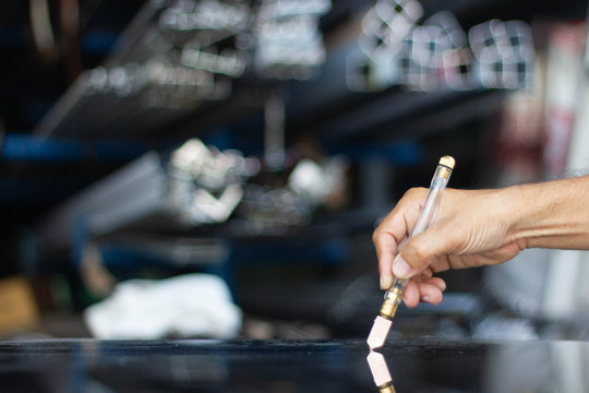 Glass cutting, focusing on the hands with tools Cut to the size that the customer ordered. - Powered by Adobe