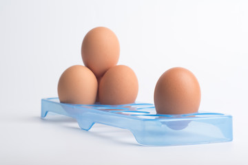 Fresh eggs on a white background.