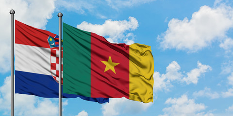 Croatia and Cameroon flag waving in the wind against white cloudy blue sky together. Diplomacy concept, international relations.