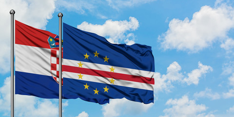 Croatia and Cape Verde flag waving in the wind against white cloudy blue sky together. Diplomacy concept, international relations.