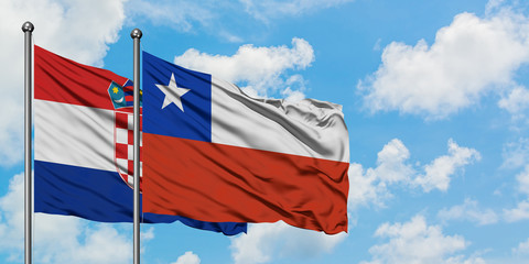 Croatia and Chile flag waving in the wind against white cloudy blue sky together. Diplomacy concept, international relations.