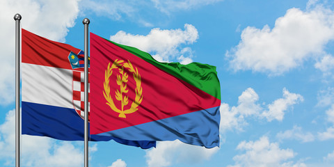 Croatia and Eritrea flag waving in the wind against white cloudy blue sky together. Diplomacy concept, international relations.