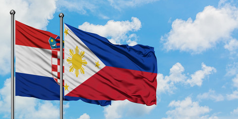 Croatia and Philippines flag waving in the wind against white cloudy blue sky together. Diplomacy concept, international relations.
