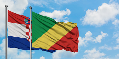 Croatia and Republic Of The Congo flag waving in the wind against white cloudy blue sky together. Diplomacy concept, international relations.