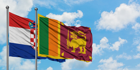 Croatia and Sri Lanka flag waving in the wind against white cloudy blue sky together. Diplomacy concept, international relations.