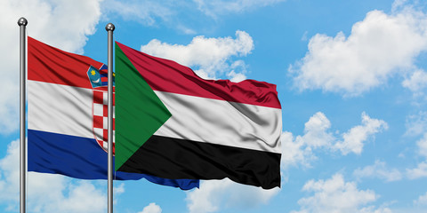 Croatia and Sudan flag waving in the wind against white cloudy blue sky together. Diplomacy concept, international relations.