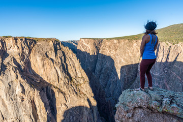 Woman Doing Handstands and Looking over the Black Canyon of the Gunnison
